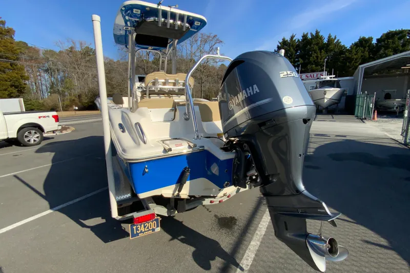 Slide: The Image of 2019 Key West 239 FS boat with Yamaha 250 engine in parking lot. - 8