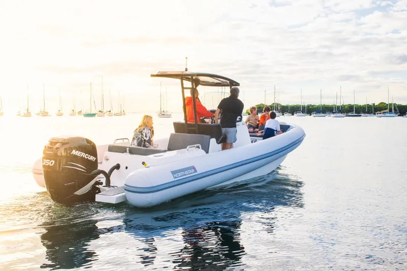 Slide: The Image of 2024 Northstar Orion 8 boat cruising on a sunny day with passengers. - 18