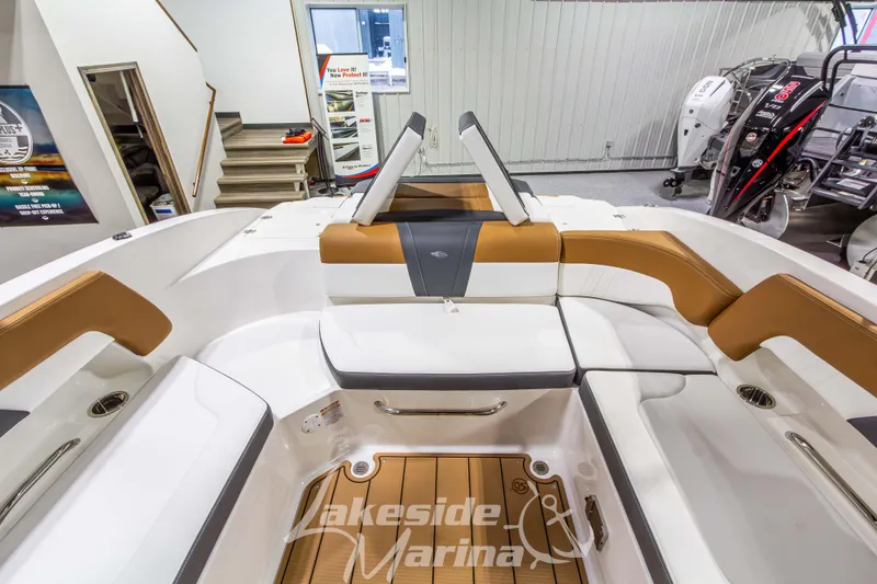 Slide: The Image of 2026 Chaparral 23 SSi boat interior with tan and white seating at Lakeside Marina. - 15