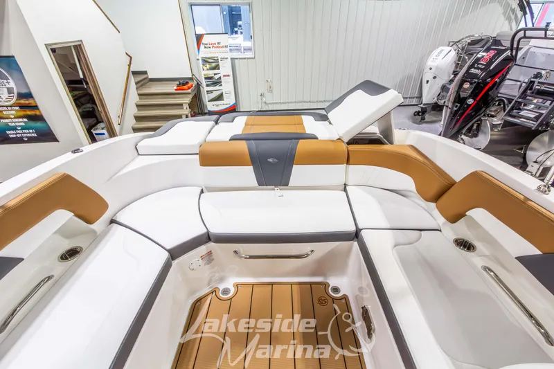 Slide: The Image of 2026 Chaparral 23 SSi boat interior with luxurious seating at Lakeside Marina. - 18