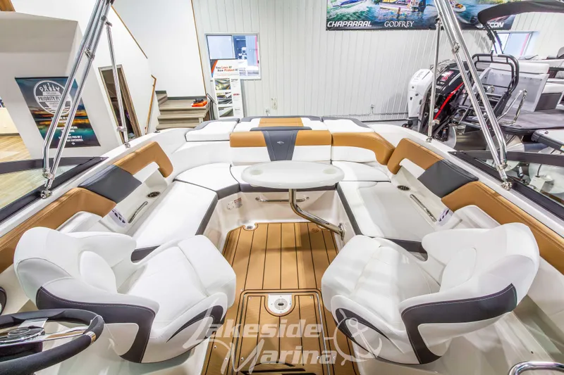Slide: The Image of 2026 Chaparral 23 SSi boat interior with luxurious seating and modern design at Lakeside Marina. - 20