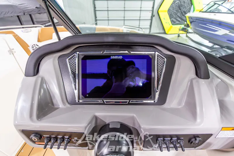 Slide: The Image of Dashboard of 2026 Chaparral 23 SSi boat with Simrad display and controls. - 22