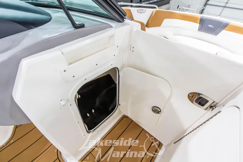 Slide: The Image of 2026 Chaparral 23 SSi boat interior storage compartment with sleek design and modern features. - 26