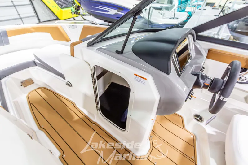 Slide: The Image of 2026 Chaparral 23 SSi boat interior with modern dashboard and seating. - 27