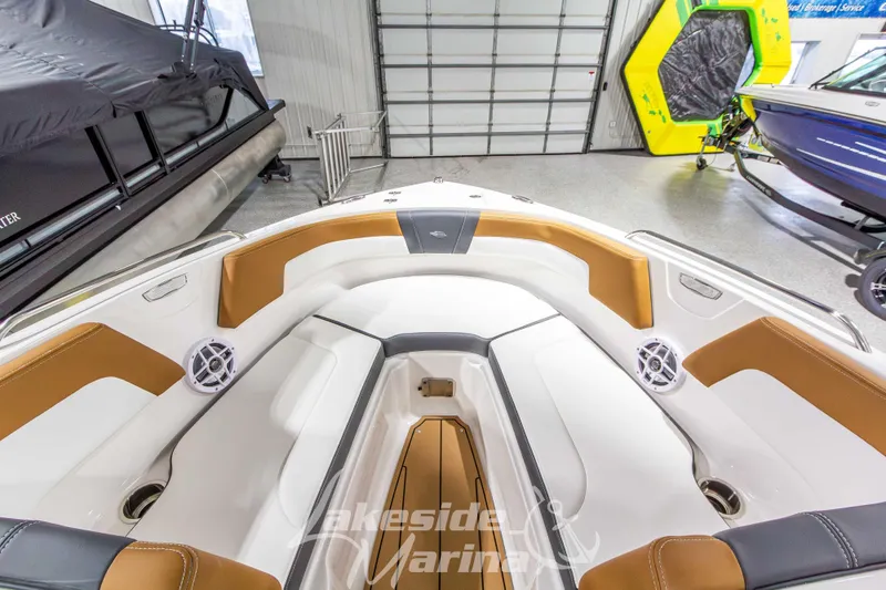 Slide: The Image of Interior view of 2026 Chaparral 23 SSi boat with tan and white seating. - 32