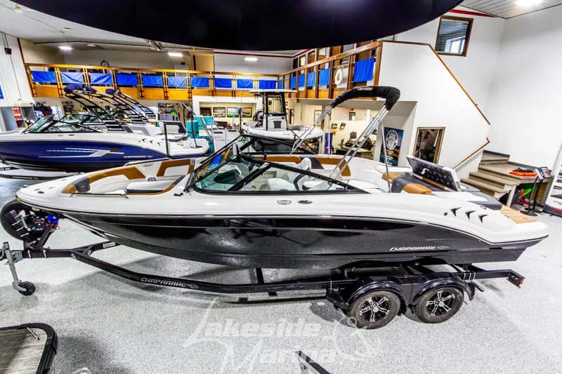 Slide: The Image of 2026 Chaparral 23 SSi boat displayed in showroom, featuring sleek design and modern amenities. - 8