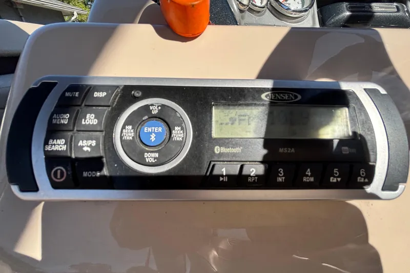 Slide: The Image of Jensen audio system on 2019 Sun Tracker Party Barge 20 DLX, featuring Bluetooth connectivity. - 24