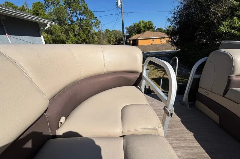 Slide: The Image of 2019 Sun Tracker Party Barge 20 DLX with beige seating and metal railings. - 31