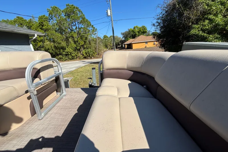 Slide: The Image of 2019 Sun Tracker Party Barge 20 DLX pontoon boat with beige seating, outdoor setting. - 34