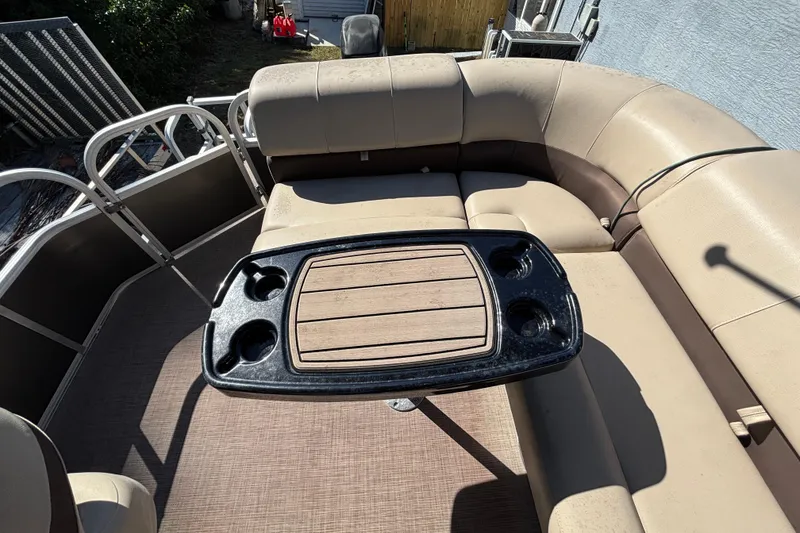 Slide: The Image of 2019 Sun Tracker Party Barge 20 DLX interior with seating and table. - 67