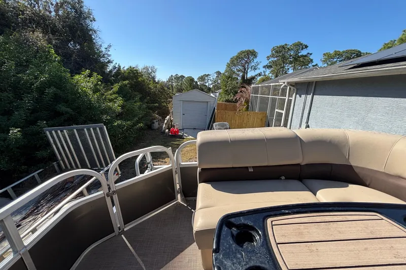 Slide: The Image of 2019 Sun Tracker Party Barge 20 DLX parked near a house and shed. - 69