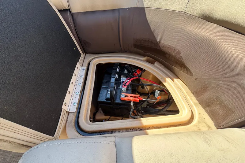 Slide: The Image of Trailer wheels of a 2019 Sun Tracker Party Barge 20 DLX on grass. - 75