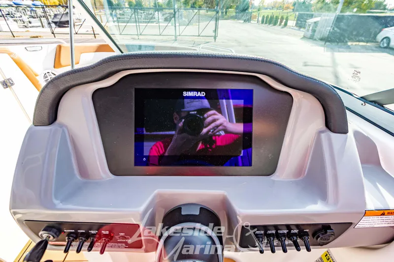 Slide: The Image of Dashboard of 2026 Chaparral 23 SSi boat with Simrad display and controls. - 14