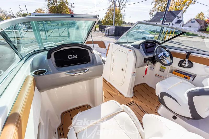 Slide: The Image of 2026 Chaparral 23 SSi boat interior with modern dashboard and seating. - 15