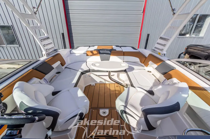 Slide: The Image of 2026 Chaparral 23 SSi boat interior with luxurious seating and modern design. - 19