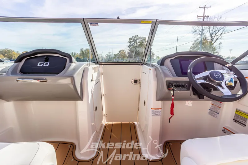 Slide: The Image of 2026 Chaparral 23 SSi boat interior with modern dashboard and steering wheel. - 20
