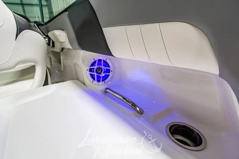 Slide: The Image of Interior of 2026 Chaparral 23 SSi boat with blue LED lighting and speaker. - 14