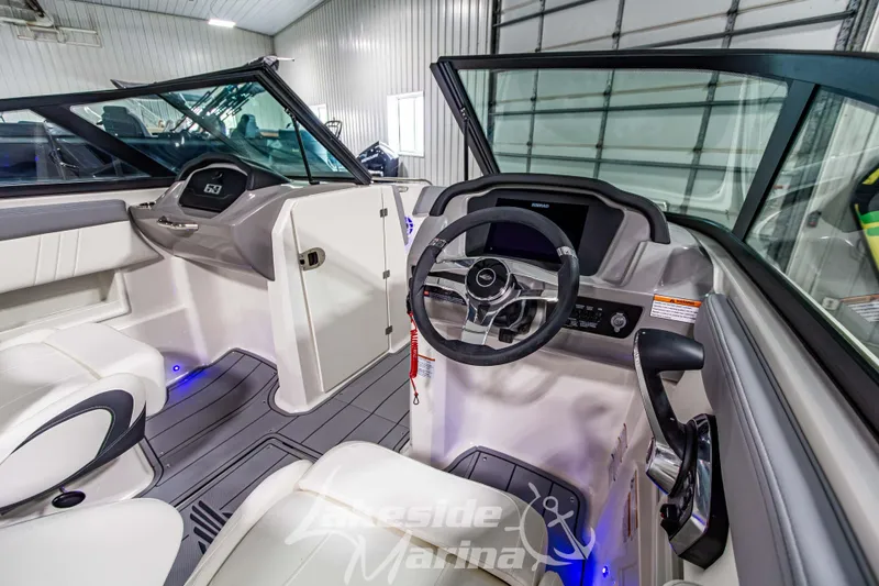 Slide: The Image of Interior view of 2026 Chaparral 23 SSi boat with modern steering and dashboard. - 15