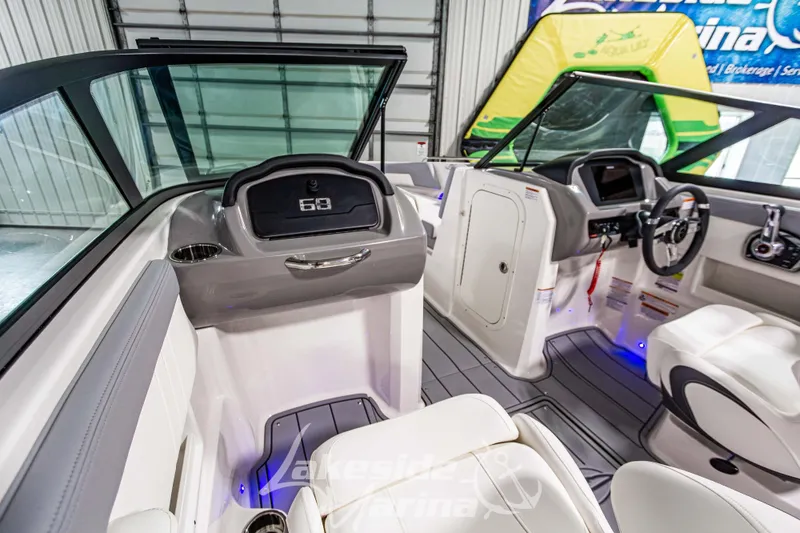 Slide: The Image of 2026 Chaparral 23 SSi boat interior with modern dashboard and seating. - 17