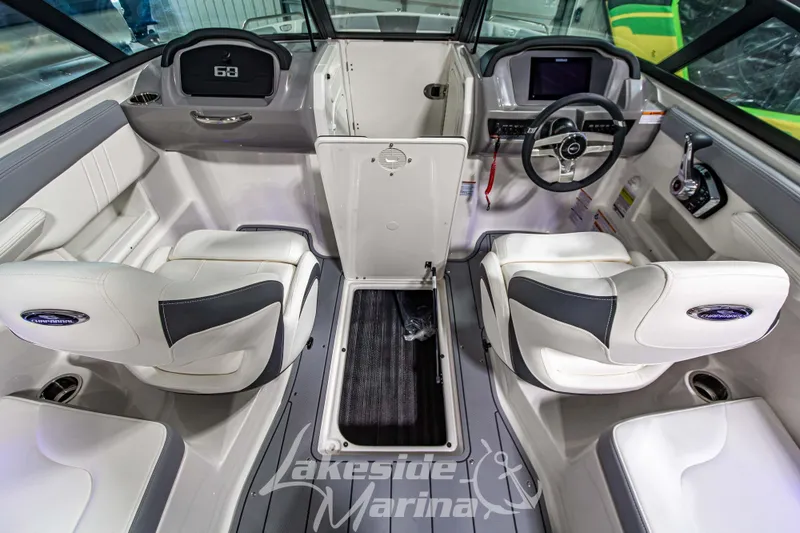 Slide: The Image of 2026 Chaparral 23 SSi boat interior with modern dashboard and seating. - 20