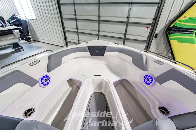 Slide: The Image of 2026 Chaparral 23 SSi boat interior with modern seating and illuminated speakers. - 25