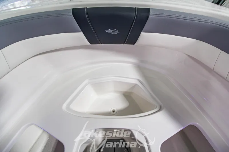 Slide: The Image of 2026 Chaparral 23 SSi boat interior with sleek seating and storage area. - 26