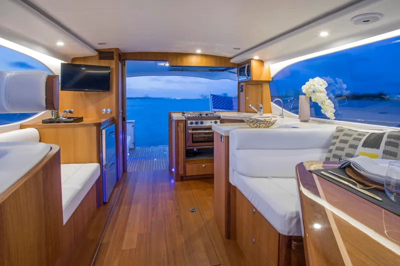 Slide: The Image of Luxurious interior of 2025 Hylas M49 yacht with modern kitchen and elegant seating. - 16