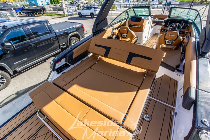 Slide: The Image of 2026 Chaparral SSX 6 boat interior with luxurious tan seating and modern dashboard. - 11