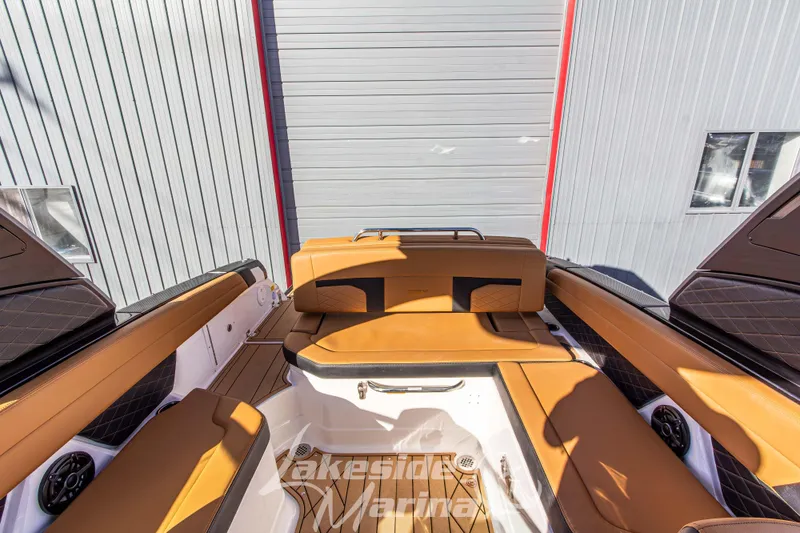 Slide: The Image of 2026 Chaparral SSX 6 boat interior with tan leather seating and modern design. - 14