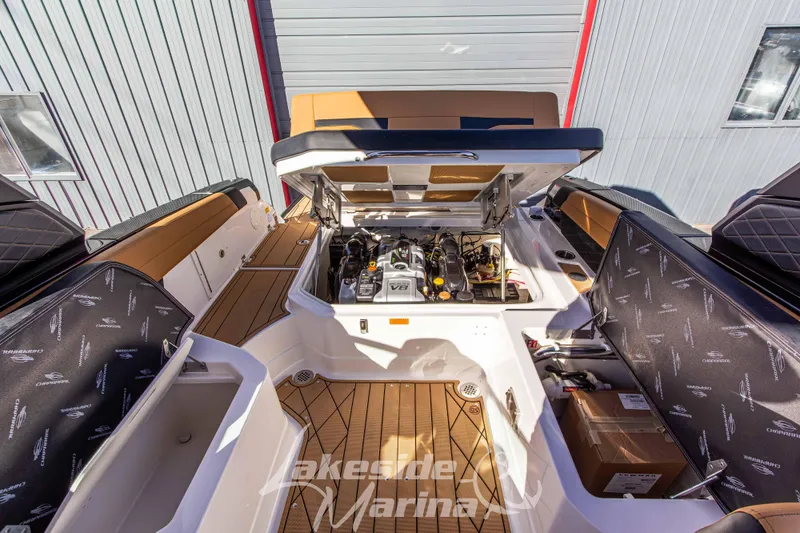 Slide: The Image of 2026 Chaparral SSX 6 boat engine compartment with open hatch, showcasing interior details. - 15