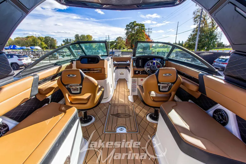 Slide: The Image of Interior of 2026 Chaparral SSX 6 boat with luxurious seating and modern dashboard. - 18