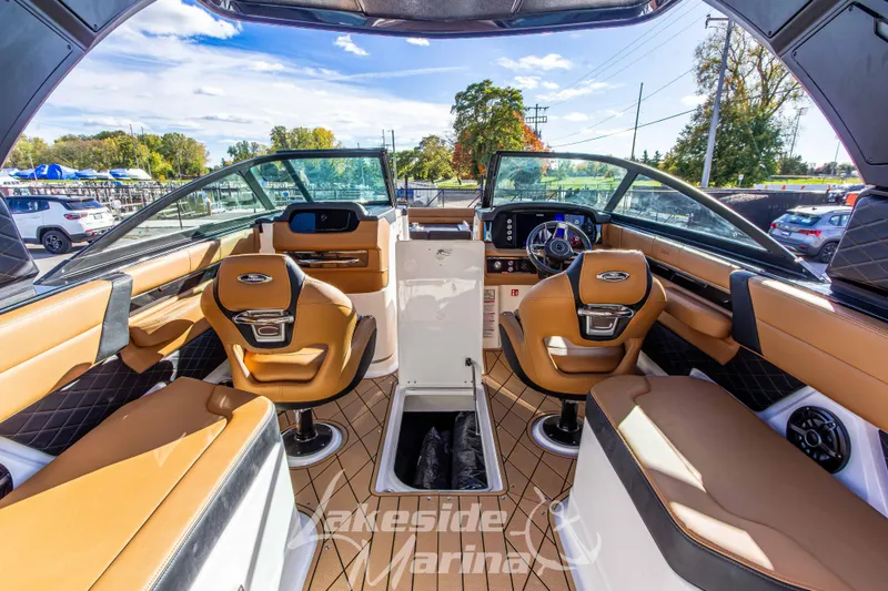 Slide: The Image of Interior of 2026 Chaparral SSX 6 boat with luxurious seating and modern dashboard. - 19