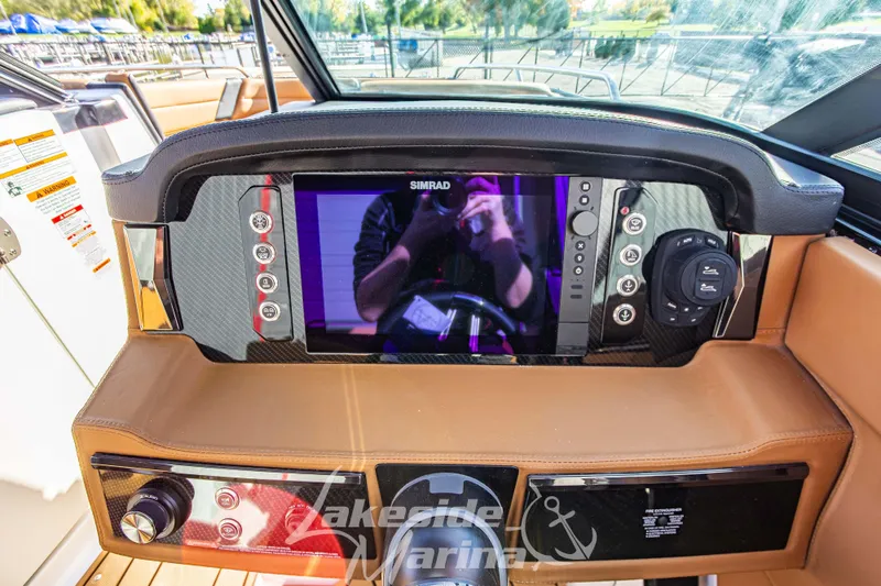 Slide: The Image of 2026 Chaparral SSX 6 dashboard with Simrad display and control panel at Lakeside Marina. - 21