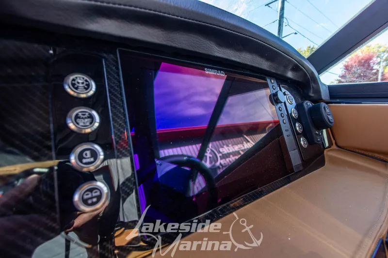 Slide: The Image of 2026 Chaparral SSX 6 dashboard with Simrad display and control buttons. - 22