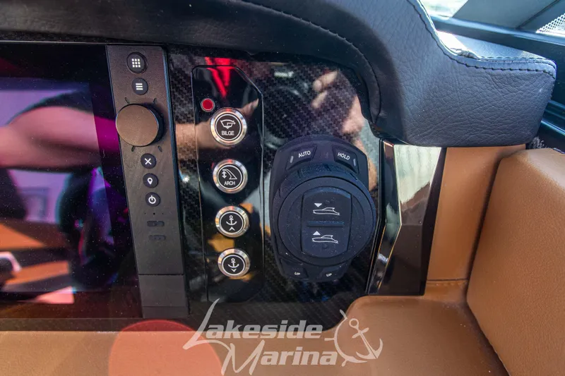 Slide: The Image of Dashboard controls of 2026 Chaparral SSX 6 boat at Lakeside Marina. - 23