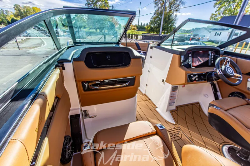 Slide: The Image of 2026 Chaparral SSX 6 boat interior with luxurious seating and modern dashboard. - 24