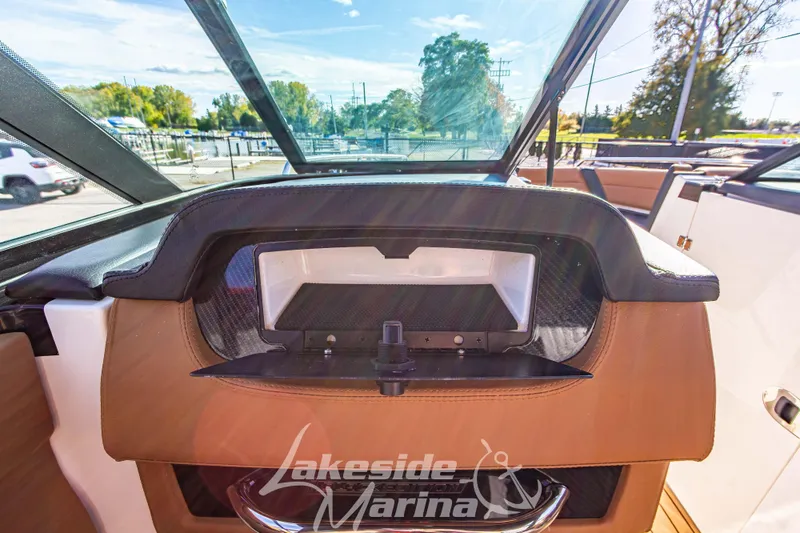 Slide: The Image of 2026 Chaparral SSX 6 boat interior with sleek dashboard and modern design at Lakeside Marina. - 25