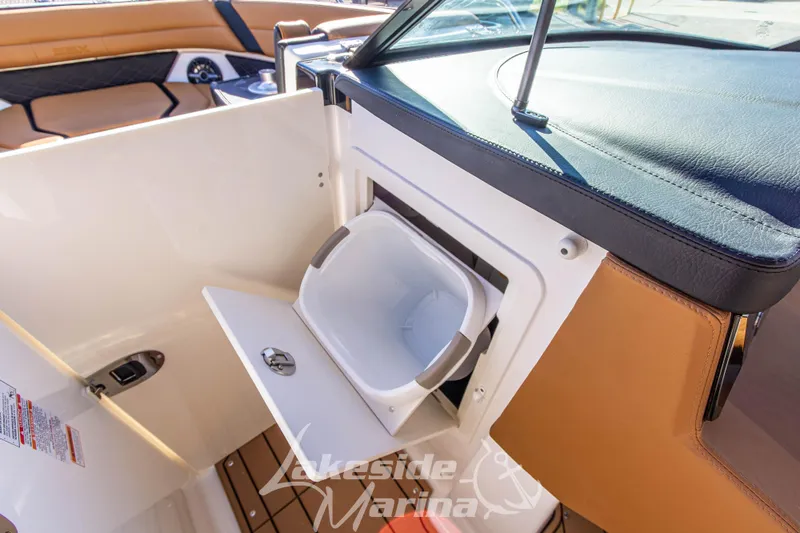 Slide: The Image of 2026 Chaparral SSX 6 boat interior with built-in storage compartment at Lakeside Marina. - 28