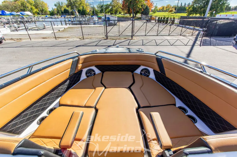 Slide: The Image of 2026 Chaparral SSX 6 boat interior with tan leather seating and modern design. - 30