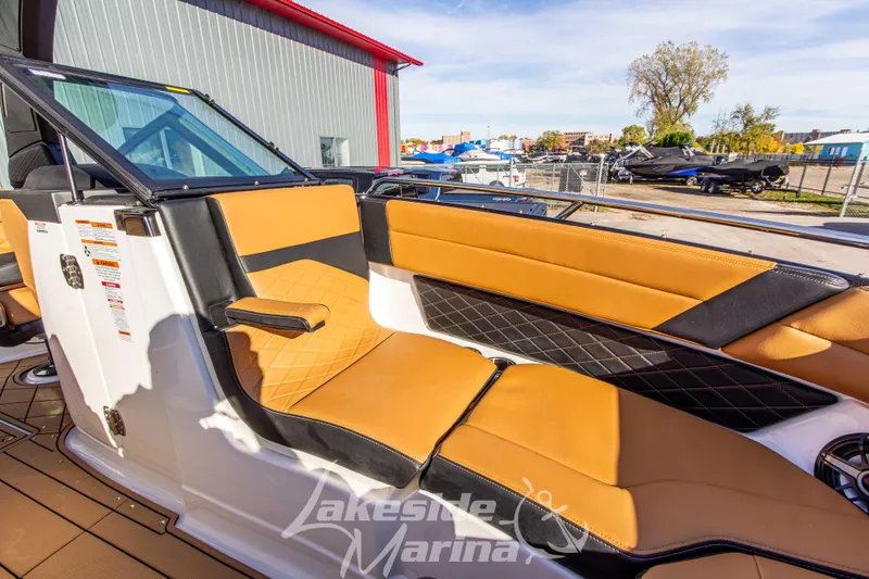Slide: The Image of 2026 Chaparral SSX 6 boat interior with tan and black seating at Lakeside Marina. - 33