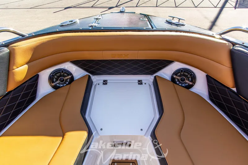 Slide: The Image of 2026 Chaparral SSX 6 boat interior with tan seating and built-in speakers. - 34