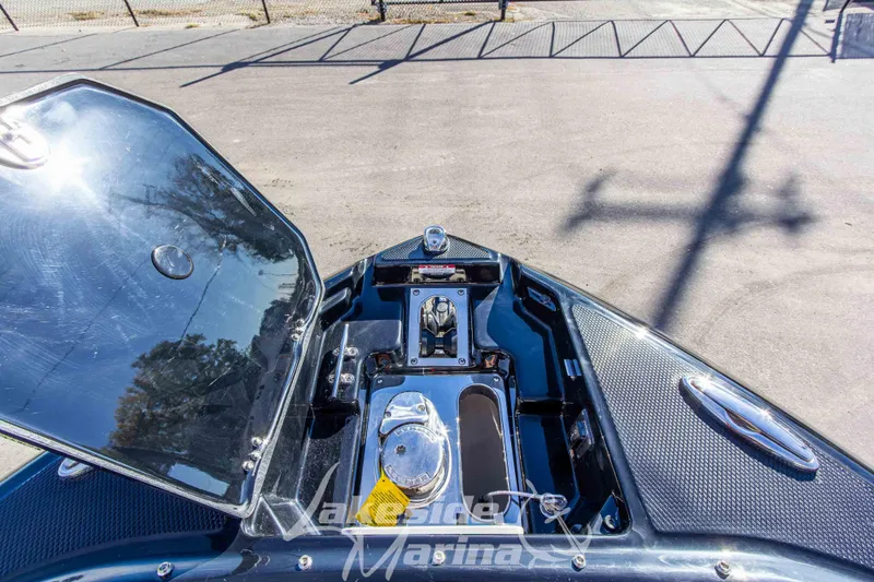 Slide: The Image of 2026 Chaparral SSX 6 boat deck with open storage compartment, showcasing sleek design. - 38