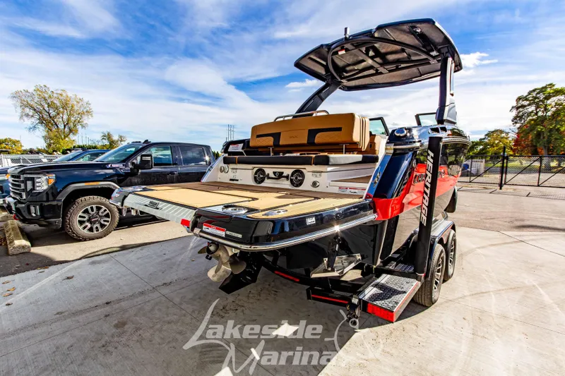 Slide: The Image of 2026 Chaparral SSX 6 boat on trailer at Lakeside Marina, sunny day. - 4