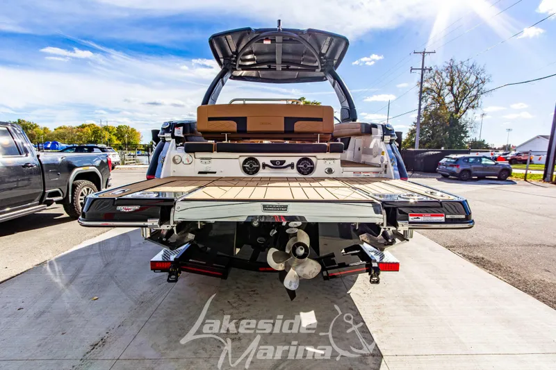 Slide: The Image of 2026 Chaparral SSX 6 boat at Lakeside Marina, showcasing rear deck and propeller. - 5