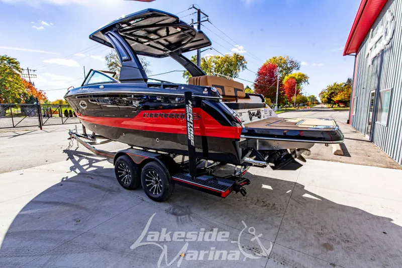 Slide: The Image of 2026 Chaparral SSX 6 boat on trailer at Lakeside Marina, vibrant autumn backdrop. - 7