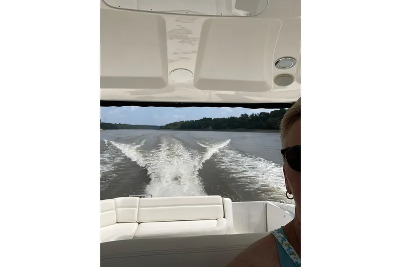 Slide: The Image of 2003 Sea Ray 550 Sundancer cruising on a river, view from the deck. - 10