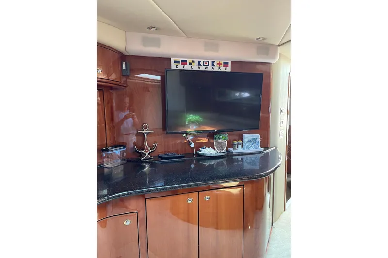 Slide: The Image of Luxurious interior of 2003 Sea Ray 550 Sundancer yacht with TV and decor. - 14