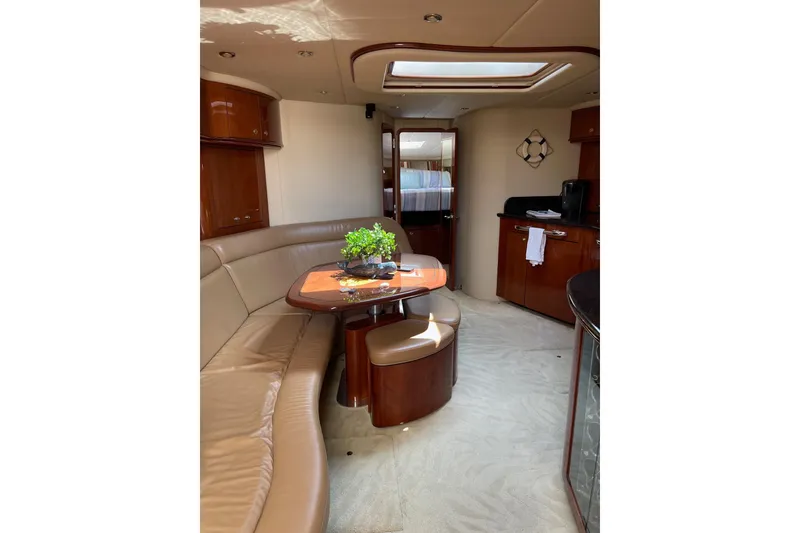 Slide: The Image of Luxurious interior of 2003 Sea Ray 550 Sundancer yacht with elegant seating and decor. - 21