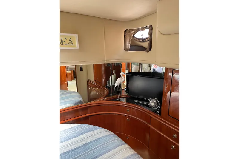Slide: The Image of Luxurious interior of 2003 Sea Ray 550 Sundancer yacht with TV and elegant decor. - 28