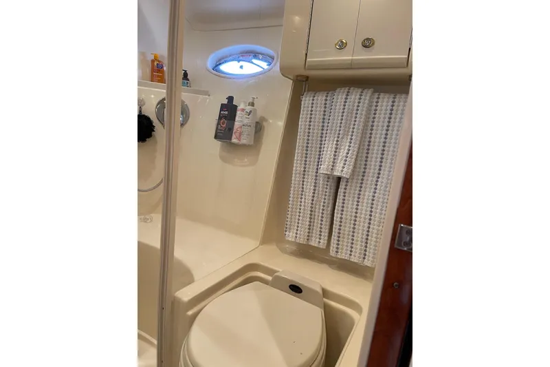 Slide: The Image of Bathroom interior of 2003 Sea Ray 550 Sundancer yacht, featuring shower and toilet. - 30